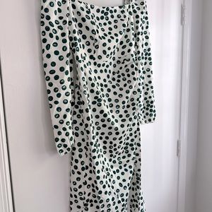 Never worn. Tags on. Green and white polka dot dress. Mid length. Long sleeves.